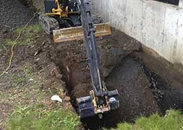 Mini excavation for foundation repair in a confined space